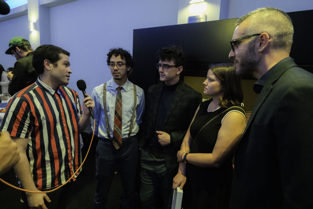 Ross Morin and film crew get interviewed on the spot at The Artists Forum Festival of the Moving Image: 2019 at the Dolby Screening Room, NYC
