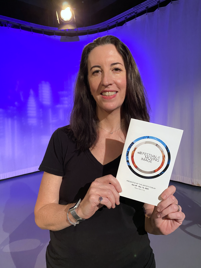 Filmmaker Jess Irish with our 2021 program, featuring an image from her film, This Mortal Plastik