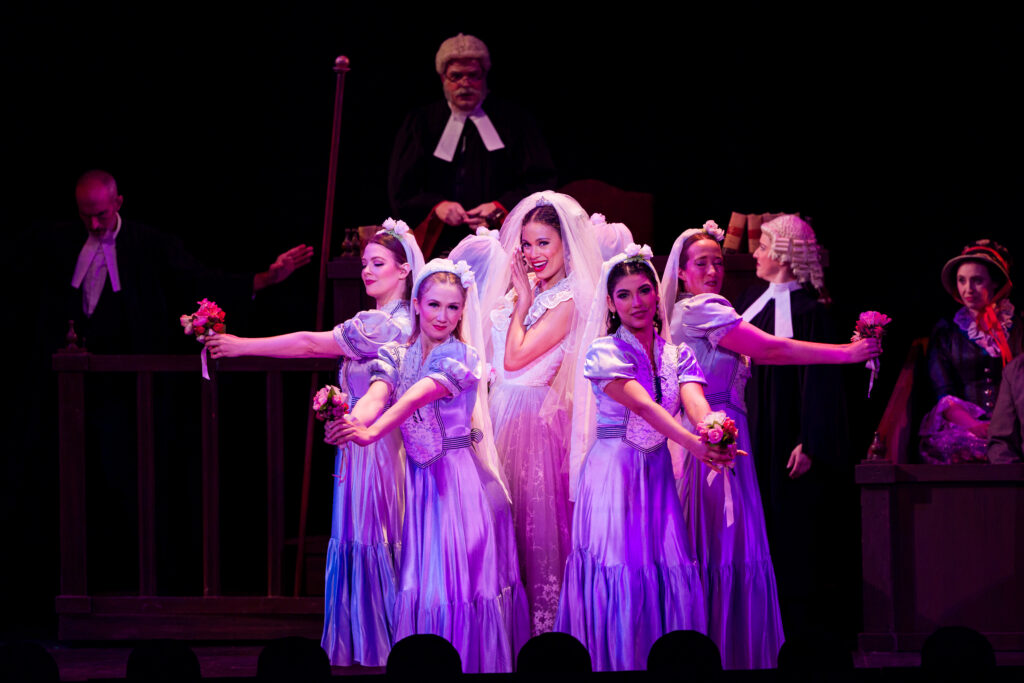 Rebecca L. Hargrove (center) as Angelina in NYGASP’s Trial by Jury. Photo Credit: Danny Bristol
