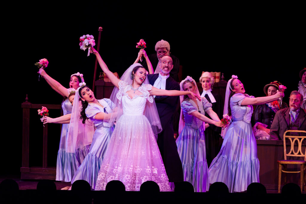 Rebecca L. Hargrove (center) as Angelina in NYGASP’s Trial by Jury. Photo Credit: Danny Bristol