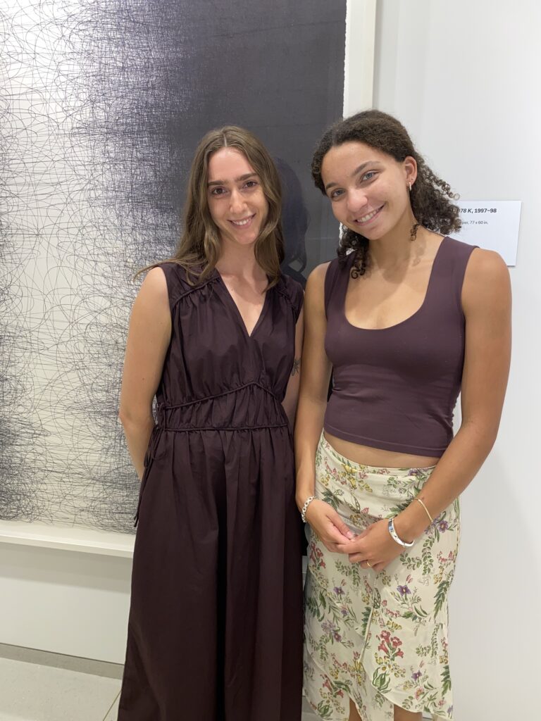 The Artists Forum Magazine writer Ella Bowers and the Vilcek Foundation's Olivia Wrobleski pose with Il Lee's "Untitled 978 K" (Photo by Amos White V)